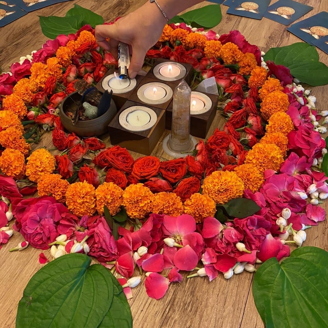 Altar space with candles, crystals and floral mandala